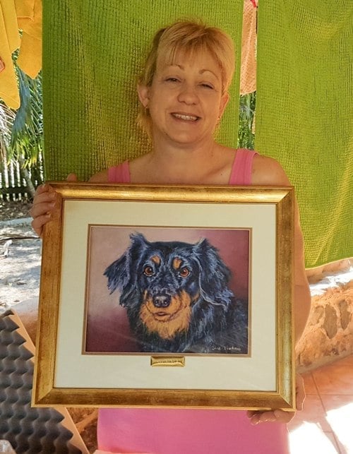 Sue is presented with a memorial pet potrait dog painting painted from a photo