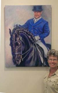 A large portrait of a dressage rider on his fresian horse
