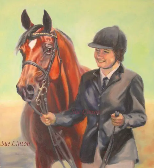 A portrait of a young girl leading her arab mare