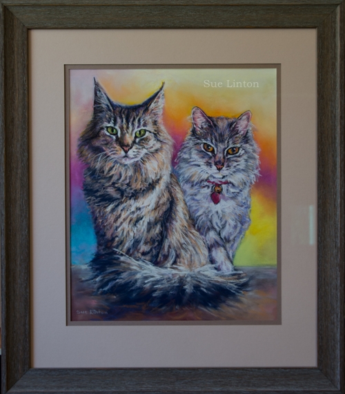 A framed pet portrait of 2 cats
