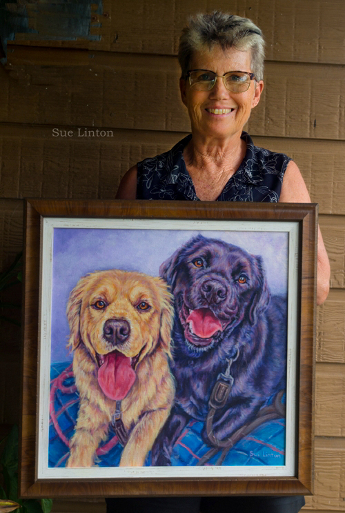 A custom framed per portrait of 2 dogs