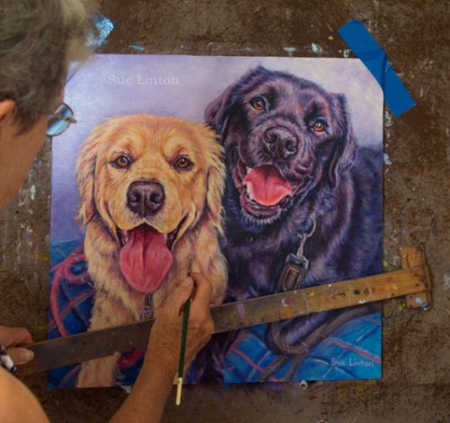 Sue painting a pet portrait