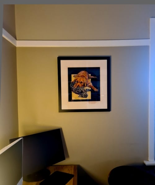 The finished fun dog and cat portrait hung on the wall